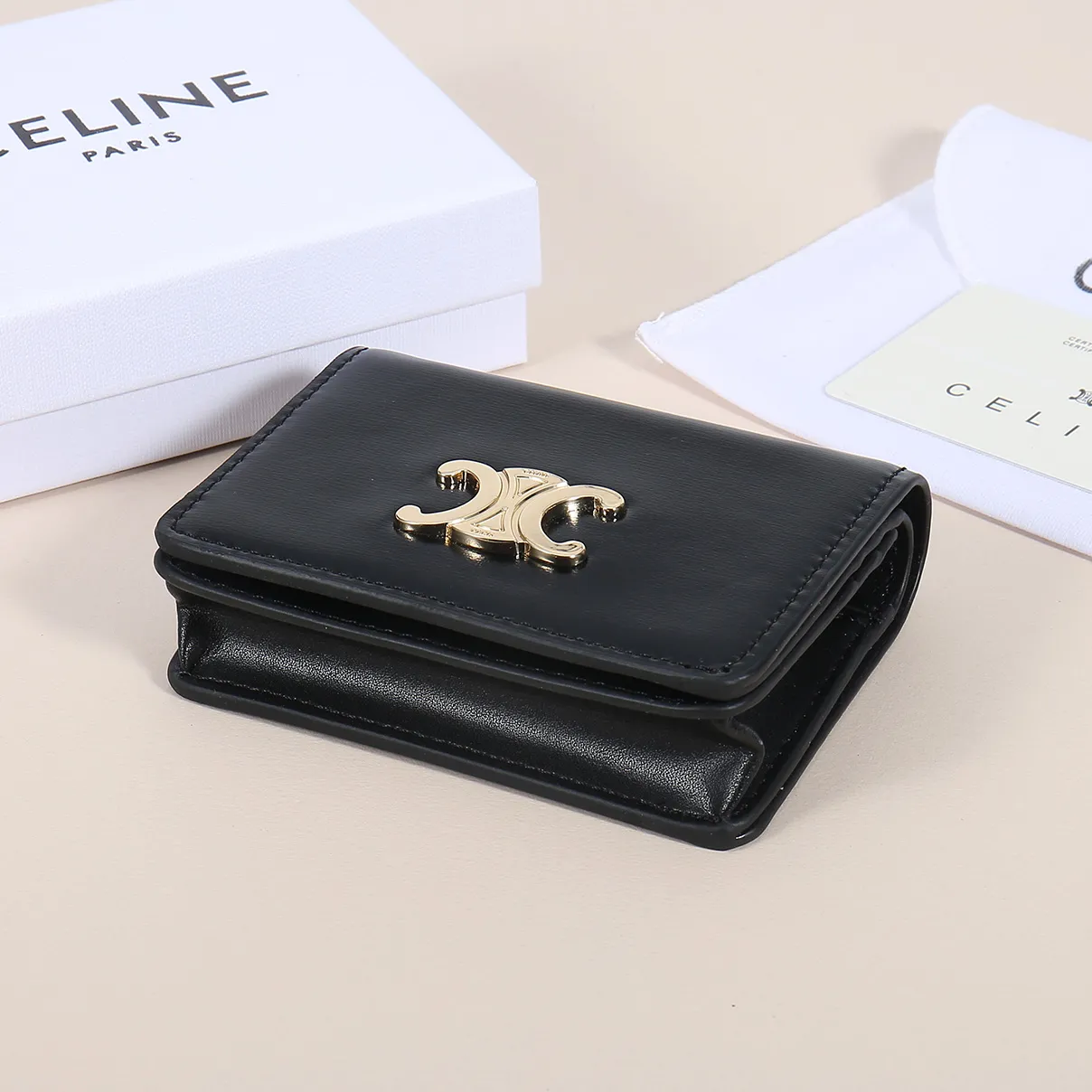 60. Celine classic card holder, TRIOMPHE business card holder, large cowhide interior with plain microfiber TRIOMPHE CANVAS logo print, gold finish TRIOMPHE metal snap closure, 1 zipper coin pocket, 5 card slots, 1 banknote pocket, 1 flat pocket No.: 10K623 Size: 11 X 9 X 3 cm