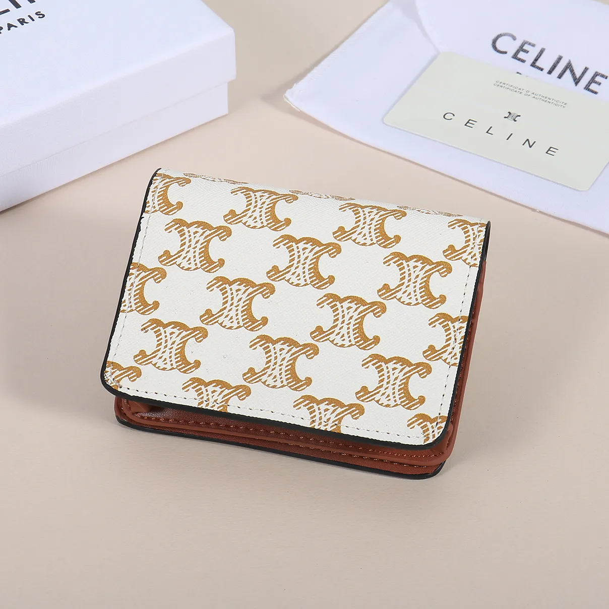 60. Celine classic card holder, TRIOMPHE business card holder, large cowhide interior with plain microfiber TRIOMPHE CANVAS logo print, gold finish TRIOMPHE metal snap closure, 1 zipper coin pocket, 5 card slots, 1 banknote pocket, 1 flat pocket No.: 10K623 Size: 11 X 9 X 3 cm
