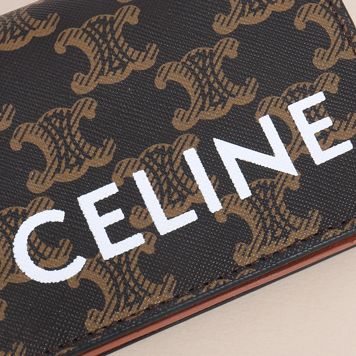 60. Celine classic card holder, TRIOMPHE business card holder, large cowhide interior with plain microfiber TRIOMPHE CANVAS logo print, gold finish TRIOMPHE metal snap closure, 1 zipper coin pocket, 5 card slots, 1 banknote pocket, 1 flat pocket No.: 10K623 Size: 11 X 9 X 3 cm