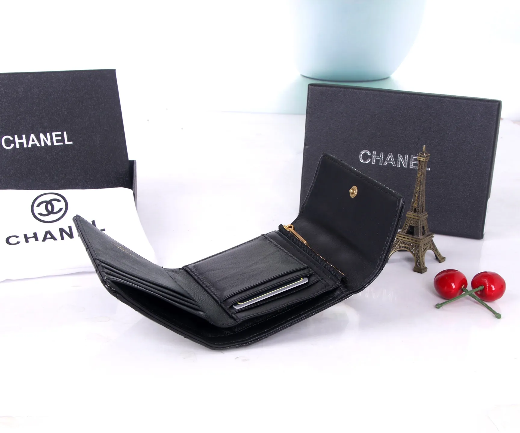 P170 Style No.: 803 Brand: Chanel Color: Black Maroon Size: 11*10*2 Description: Chanel’s autumn and winter new styles are now available! Made of first-layer sheepskin inside and outside, the workmanship is exquisite, comparable to that of counters! Multifunctional tri-fold small wallet, super practical!