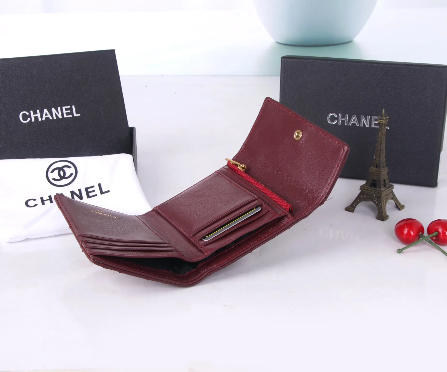 P170 Style No.: 803 Brand: Chanel Color: Black Maroon Size: 11*10*2 Description: Chanel’s autumn and winter new styles are now available! Made of first-layer sheepskin inside and outside, the workmanship is exquisite, comparable to that of counters! Multifunctional tri-fold small wallet, super practical!