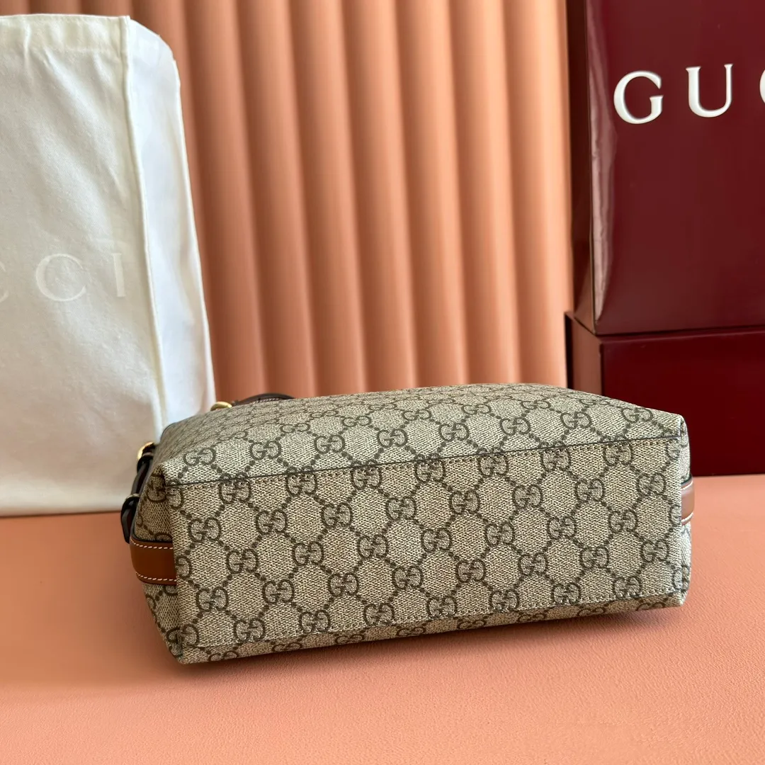p1060. 💋💋💋【With full set of original counter packaging】💕The GG Emblem series reinterprets the brand's timeless elegance and exquisite craftsmanship. This shoulder bag is made of coated fabric with the iconic GG monogram pattern and matched with a webbing cotton lining, showing off its exquisite charm. Beige and dark brown GG monogram coated fabric Brown leather trim Light gold tone hardware Webbing cotton lining Interior: Zip pocket Leather shoulder strap: Height: 30 cm - 47 cm; Length: 115 cm Zip closure Ident.: 848881. Dimensions: 24cm (width) x 26cm (height) x 10cm (depth) Weight: approx. 0.55kg Color: Brown/PVC. Made in Italy