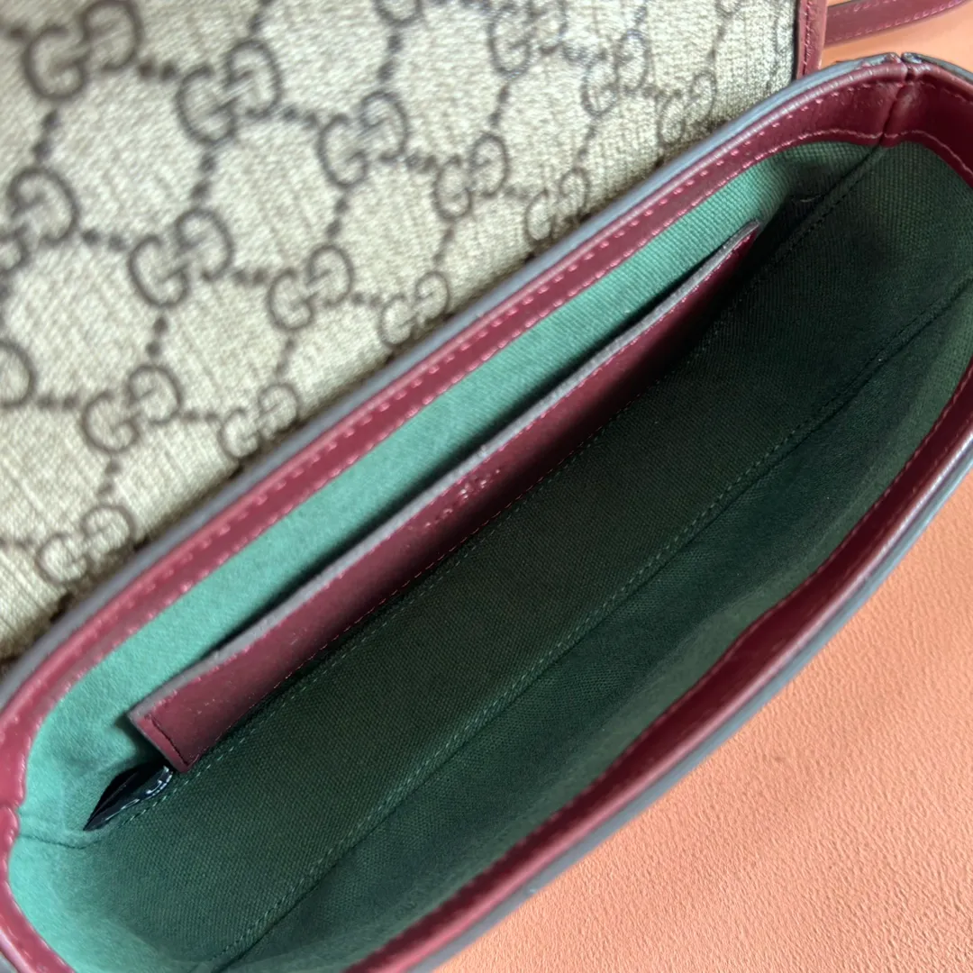 p960. 💋💋💋"With full set of original counter packaging"💋[New Product] The Ophidia series dazzlingly presents novel silhouettes and functions. It is ingeniously interpreted in iconic beige and brown colors to create a new bag item with soft texture. Beige and dark brown GG canvas Ankara red leather trim Light gold tone hardware Green cotton lining Double G Interior: One open pocket Carry handles (2.5 cm high) Removable and adjustable leather shoulder strap (height: 46 cm to 54 cm; length: 101 cm to 116 cm) Ident.: 836843. Dimensions: 20cm (width) x 16cm (height) x 5cm (depth) Weight: approx. 0.55kg Color: Brown Anchor Red/PVC. Made in Italy