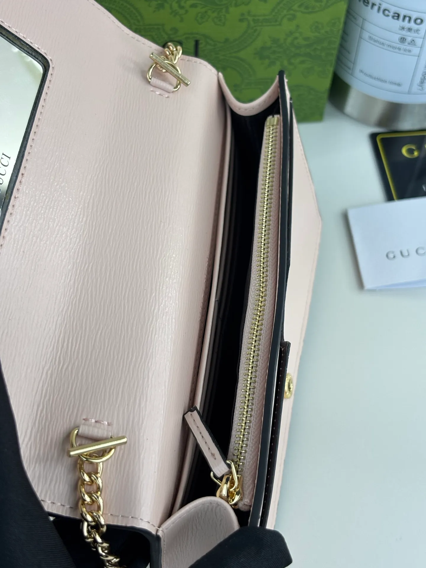 💰230 GUCCl chain wallet with handwritten Gucci logo. The small leather accessories series seamlessly integrates modern fashion elements to create ingenious items with changing styles without losing classic connotation, bringing fresh vitality to formal leather items. This chain wallet is crafted from pink leather and features the Gucci logo in gold-tone script. Pink leather, gold-tone hardware, taffeta lining, scripted Gucci logo detail, interior: six card compartments, one flat pocket, one zipped gusset pocket and one open compartment, chain strap, snap button fastening. Style No.: 772643 Size: 20cm x 12.5cm x 4cm Color: Pink