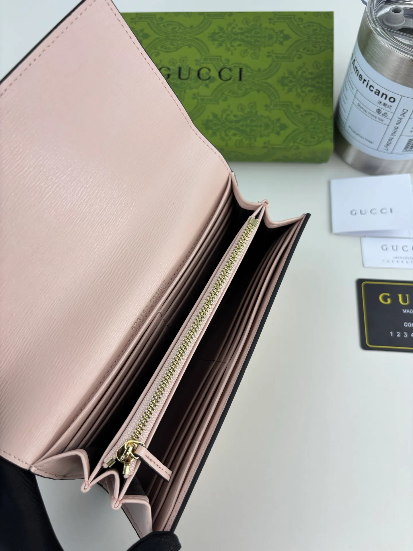 💰170 GUCCl long clip wallet with handwritten Gucci logo. Exploring self-expression with unlimited possibilities has become the spiritual connotation of brand design. Crafted from pink leather, this long clip is embellished with a gold-toned hand-written Gucci logo-shaped hardware, adding a touch of the brand's signature charm to the entire design. Pink leather, gold-tone hardware, taffeta lining and scripted Gucci logo detail. Interior: Twelve card compartments, two bill compartments, two separate internal compartments and a zippered coin pocket, this classic piece features snap fastening Style number: 772638 Dimensions: 19cm x 10cm x 3.5cm Colour: Pink