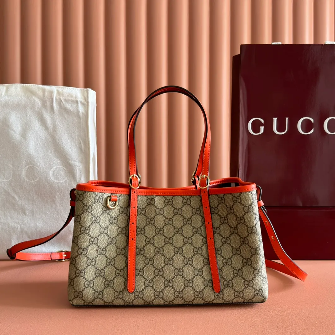 p960. 💋💋💋"With full set of original counter packaging" [New product] GG Emblem series reinterprets the brand's timeless elegance and exquisite craftsmanship. Inspired by the equestrian world, this tote bag features an adjustable top handle with numbered eyelets. Beige and dark brown GG monogram coated fabric Orange leather trim with contrasting stitching Light gold tone hardware Red and green webbing cotton lining The bag pictured is sold separately and does not come with the bag charm. Also features D-ring for attaching removable items Adjustable handle with numbered eyelets (height: 18cm - 28cm) Interior: two compartments and a central zippered compartment Adjustable leather shoulder strap (height: 51.5cm - 57cm; length: 104cm - 114cm) Magnetic snap closure Ident No.: 815214. Dimensions: 30cm (width) x 18cm (height) x 11cm (depth) Weight: approx. 0.8kg Color: Brown Orange/PVC. Made in Italy