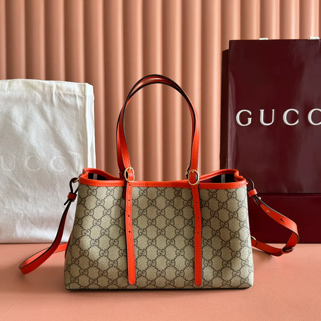 p960. 💋💋💋"With full set of original counter packaging" [New product] GG Emblem series reinterprets the brand's timeless elegance and exquisite craftsmanship. Inspired by the equestrian world, this tote bag features an adjustable top handle with numbered eyelets. Beige and dark brown GG monogram coated fabric Orange leather trim with contrasting stitching Light gold tone hardware Red and green webbing cotton lining The bag pictured is sold separately and does not come with the bag charm. Also features D-ring for attaching removable items Adjustable handle with numbered eyelets (height: 18cm - 28cm) Interior: two compartments and a central zippered compartment Adjustable leather shoulder strap (height: 51.5cm - 57cm; length: 104cm - 114cm) Magnetic snap closure Ident No.: 815214. Dimensions: 30cm (width) x 18cm (height) x 11cm (depth) Weight: approx. 0.8kg Color: Brown Orange/PVC. Made in Italy
