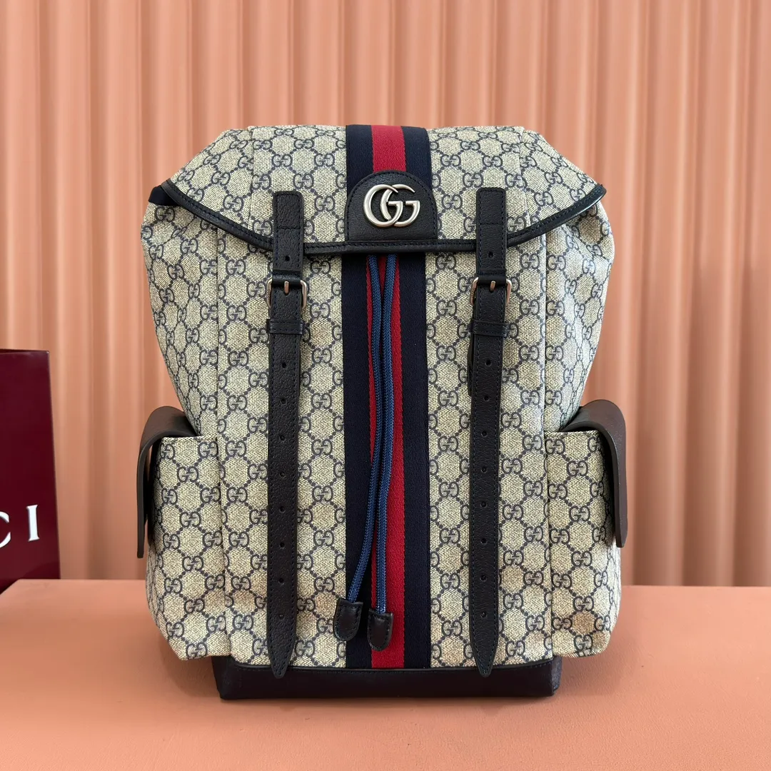 p1280. 🔥🔥🔥【With full set of original green gift bag】Ophidia series medium GG backpack. The 2024 early spring series renews the Ophidia series shoulder bags, tote bags and handbags in black GG denim, and the silver-toned accessories present a contrasting metallic texture. This Ophidia backpack in blue and black GG Supreme canvas demonstrates Gucci's design prowess in infusing the brand's iconic design elements with a modern appeal. Blue and black GG Supreme canvas, black leather piping, palladium tone hardware, cotton and linen blend lining, black mesh Double G on the back, flap side pockets with magnetic closure, inner phone pocket and padded tablet sleeve, adjustable shoulder strap, black mesh back, drawstring flap design, leather buckle fastening strap and extra magnetic buckle for easy opening and closing, weight: approx. 1.272 kg. Model: 598140. Dimensions: 40(length) x 24(width) x 16cm(thickness) Color: blue/pvc. Made in Italy