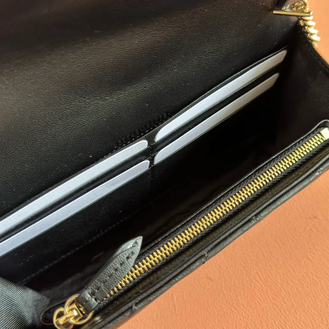 p760. 💋💋💋"With full set of original counter packaging" [New product] This GG Marmont series chain wallet is crafted with Matelassé cow leather. The series' iconic double G accessories make the entire design fuller. Black quilted V-shaped calfskin Leather Light gold-tone hardware Black taffeta lining Double G Interior: six card compartments, one zip pocket and one flap pocket Chain shoulder strap (60 cm high) Press-button closure Ident.: 837745. Dimensions: 20cm (width) x 12cm (height) x 4cm (depth) Weight: approx. 357g