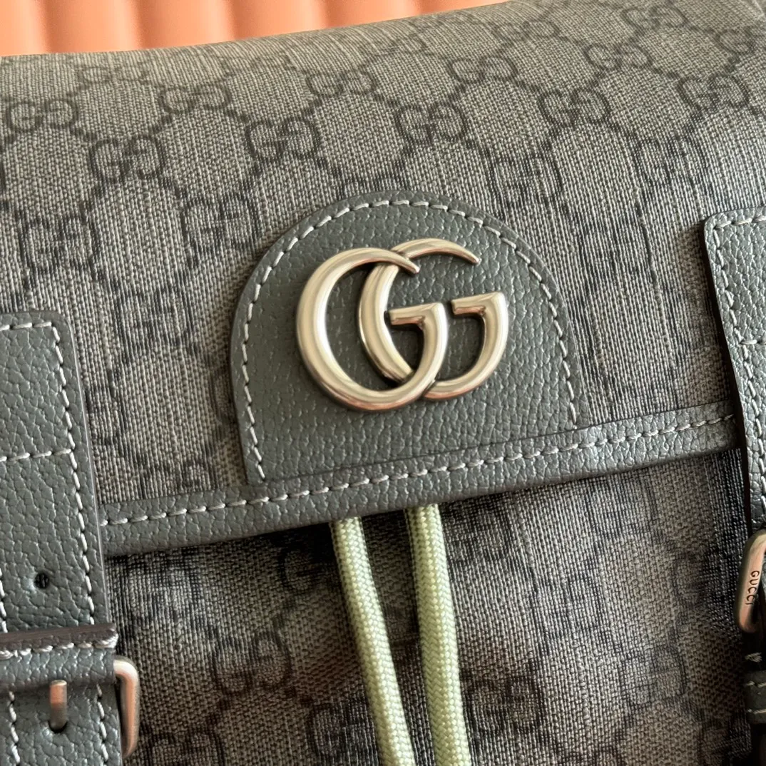 p1280. 🔥🔥🔥【With full set of original green gift bag】Ophidia series medium GG backpack. The 2024 early spring series renews the Ophidia series shoulder bags, tote bags and handbags in black GG denim, and the silver-toned accessories present a contrasting metallic texture. This Ophidia backpack in blue and black GG Supreme canvas demonstrates Gucci's design prowess in infusing the brand's iconic design elements with a modern appeal. Blue and black GG Supreme canvas, black leather piping, palladium tone hardware, cotton and linen blend lining, black mesh Double G on the back, flap side pockets with magnetic closure, inner phone pocket and padded tablet sleeve, adjustable shoulder strap, black mesh back, drawstring flap design, leather buckle fastening strap and extra magnetic buckle for easy opening and closing, weight: approx. 1.272 kg. Model: 598140. Dimensions: 40(length) x 24(width) x 16cm(thickness) Color: gray/pvc. Made in Italy