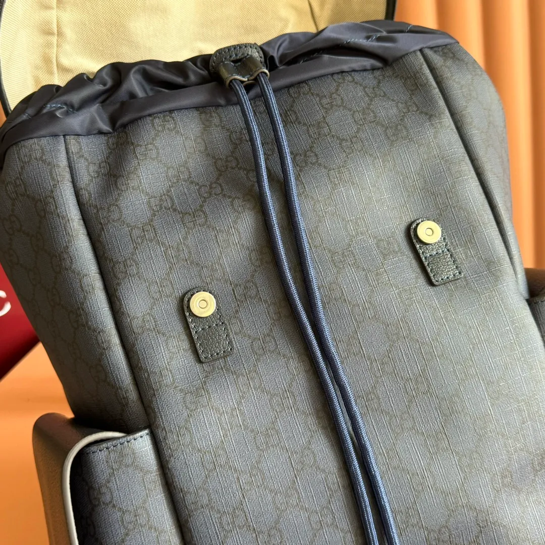 p1280. 🔥🔥🔥【With full set of original green gift bag】Ophidia series medium GG backpack. The 2024 early spring series renews the Ophidia series shoulder bags, tote bags and handbags in black GG denim, and the silver-toned accessories present a contrasting metallic texture. This Ophidia backpack in blue and black GG Supreme canvas demonstrates Gucci's design prowess in infusing the brand's iconic design elements with a modern appeal. Blue and black GG Supreme canvas, black leather piping, palladium tone hardware, cotton and linen blend lining, black mesh Double G on the back, flap side pockets with magnetic closure, inner phone pocket and padded tablet sleeve, adjustable shoulder strap, black mesh back, drawstring flap design, leather buckle fastening strap and extra magnetic buckle for easy opening and closing, weight: approx. 1.272 kg. Model: 598140. Dimensions: 40(length) x 24(width) x 16cm(thickness) Color: blue/pvc. Made in Italy