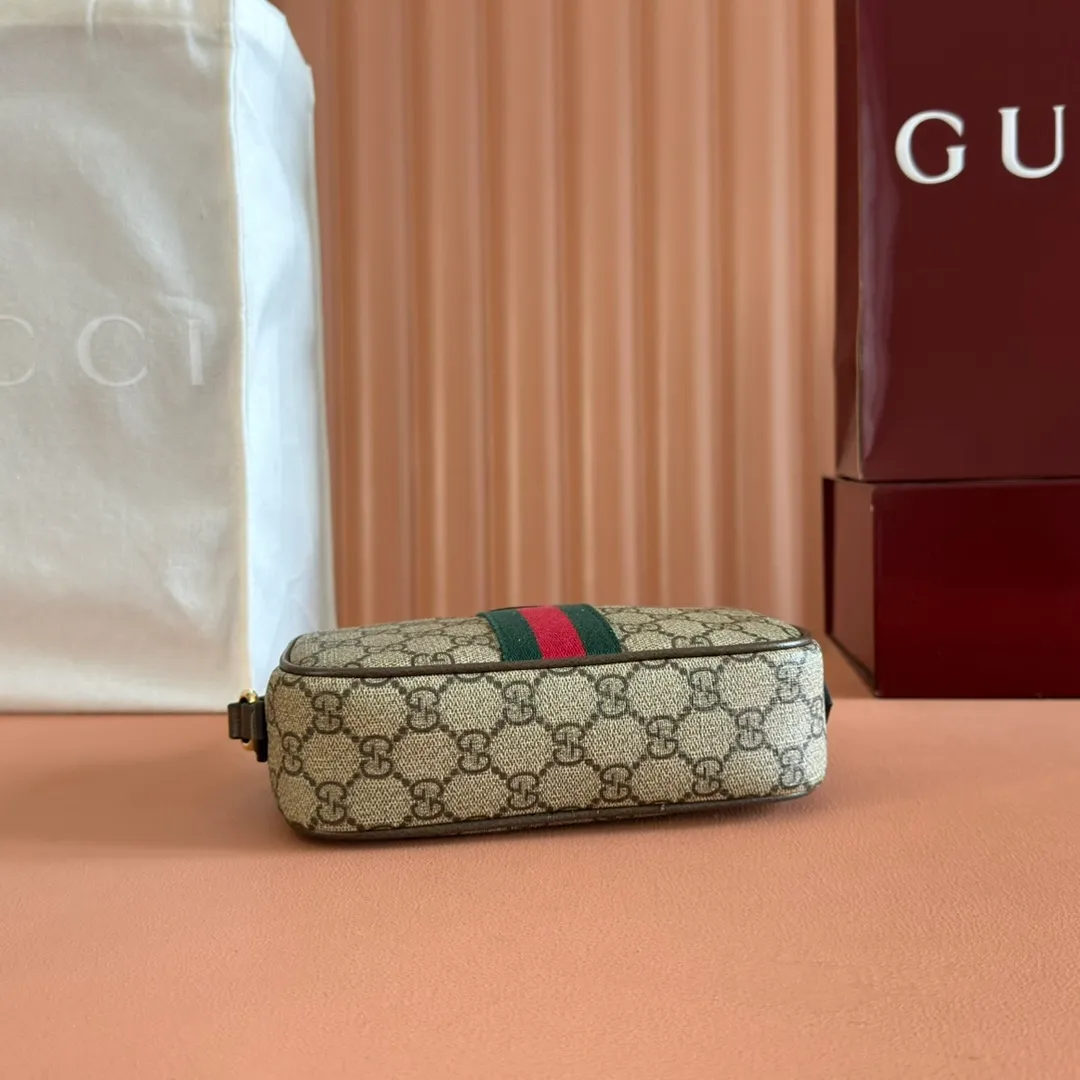 p960. 💋💋💋"With full set of original counter packaging" [New Product] Inspired by Gucci's iconic travel bag silhouette, the brand launched the Mini GG handbag. This handbag is crafted from soft GG presbyopic canvas and is equipped with web handles and a detachable shoulder strap. It reinterprets the brand's classic elements and pays homage to Gucci's proud travel tradition. Beige and dark brown GG monogram coated fabric Dark brown leather piping Light gold tone hardware Green linen cotton blend lining Carry handles (10cm high) Removable and adjustable leather shoulder strap (50cm high; Length: 101.5cm) Model: 859975. Dimensions: 20cm (W) x 13cm (H) x 13cm (D) Weight: approx. 0.4kg Colour: Brown/PVC. Made in Italy