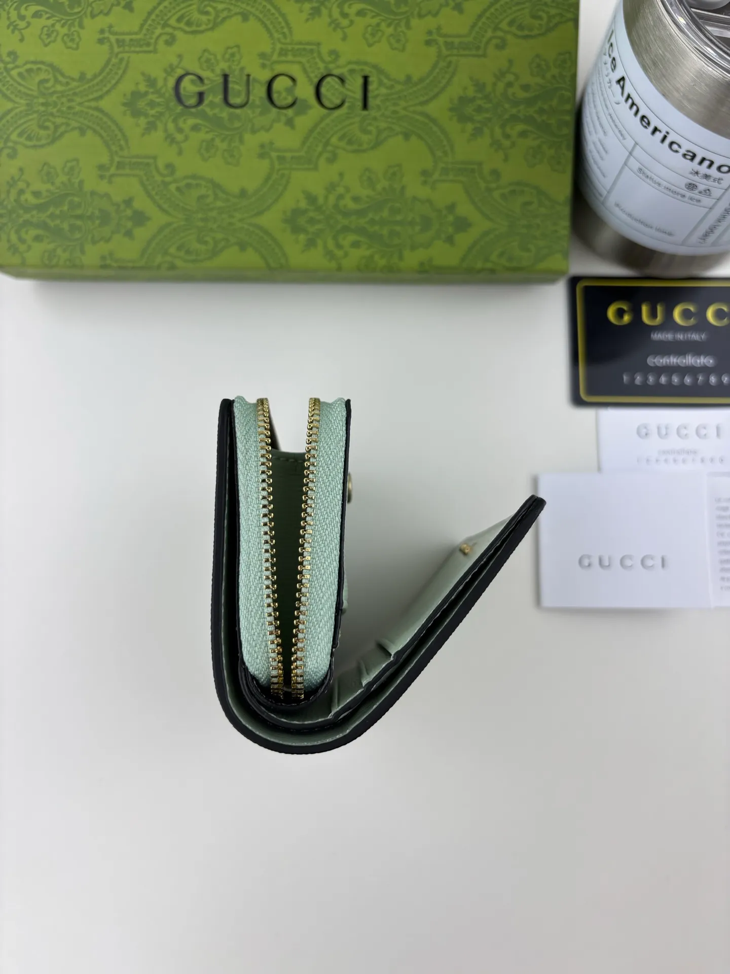 💰160 GUCCl chain wallet with handwritten Gucci logo. The small leather accessories series seamlessly integrates modern fashion elements to create ingenious items with changing styles without losing classic connotation, bringing fresh vitality to formal leather items. This chain wallet is crafted from green leather and features the Gucci logo in gold-tone script. Green leather, gold-tone hardware, taffeta lining, scripted Gucci logo detail, interior: six card compartments, one zipped gusset pocket and one open compartment, chain strap, snap button fastening. Style number: 772639 Size: 9cmx 11cmx 2.5cm Color: Green