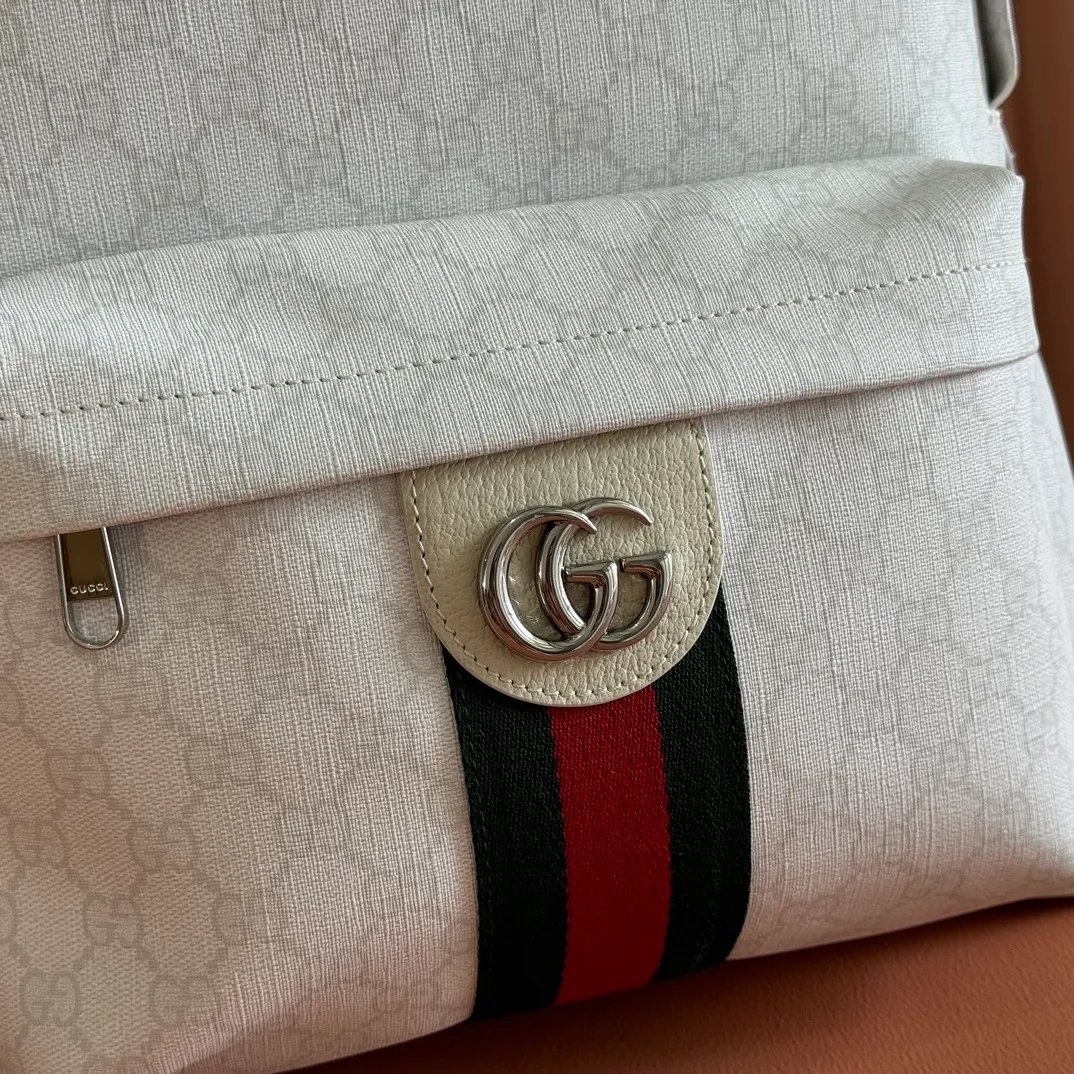 p1260💋💋💋"With full set of original counter packaging" [New product] The Ophidia series is crafted with white color matching, classic silhouette and new functional design, and is made of soft-touch fabrics. This backpack is made of soft GG Supreme material and is intricately embellished with the Double G logo and red and green webbing details. White soft GG Supreme canvas Palladium tone hardware Green nylon lining Double G Web detail Padded mesh at back Adjustable shoulder strap Interior: 1 zip pocket External: 1 zip pocket Handle height: 8 cm Zip closure Ref.: 834466. Dimensions: 36.5cm (width) x 41cm (height) x 18cm (depth) Weight: approx. 1.5kg Color: white pvc. Made in Italy