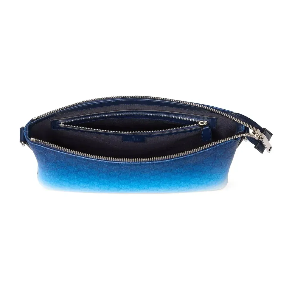 🔥The unique blue gradient effect print adds a fashionable aesthetic to this basic functional item. This clutch bag is made of GG Monogram coated fabric and has an all-over gradient print for an elegant style. Gradient blue GG Monogram coated fabric All-over gradient print Blue cotton and linen lining Interior: 1 zip pocket Detachable wrist strap (17 cm high) Zip closure Ref.: 835692. Dimensions: 31cm (width) x 24.5cm (height) x 5cm (depth) Weight: approx. 0.7kg Color: gradient blue/original leather. Made in Italy