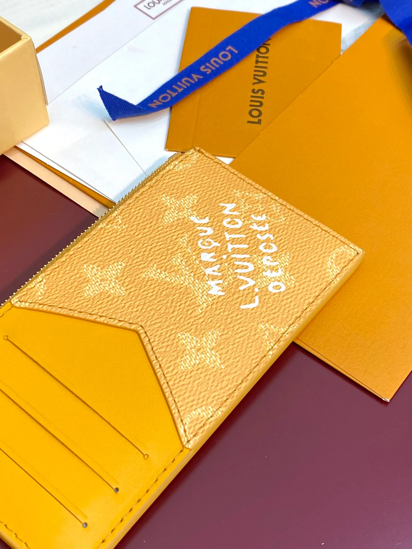 M12660 yellow! COIN card holder, Pharrell Williams draws on the traditional elements of the brand's Damier print. This time, the Coin card holder incorporates criss-crossing textures and the Marque L.Vuitton Déposée logo, creatively reshaping the classic Monogram pattern, combining practical function and elegant style.  14.5 x 1 x 8 cm (height x width x length). 💰320