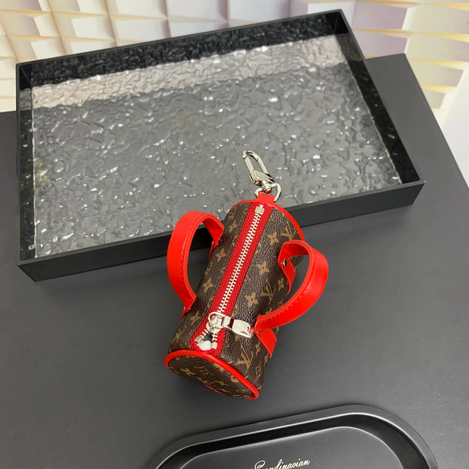 💰200 shipped😍 MINI KEEPALL bag charm and keychain ☀️Louis Vuitton Louis Vuitton lv mini pillow bag pendant ☀️This Mini Keepall bag charm and keychain condenses the classic handbag configuration, boldly showing the spirit of adventure. Monogram canvas with LV inscribed hook buckle, whether hung on a belt or handbag, its zipper closure and built-in keychain ensure secure storage