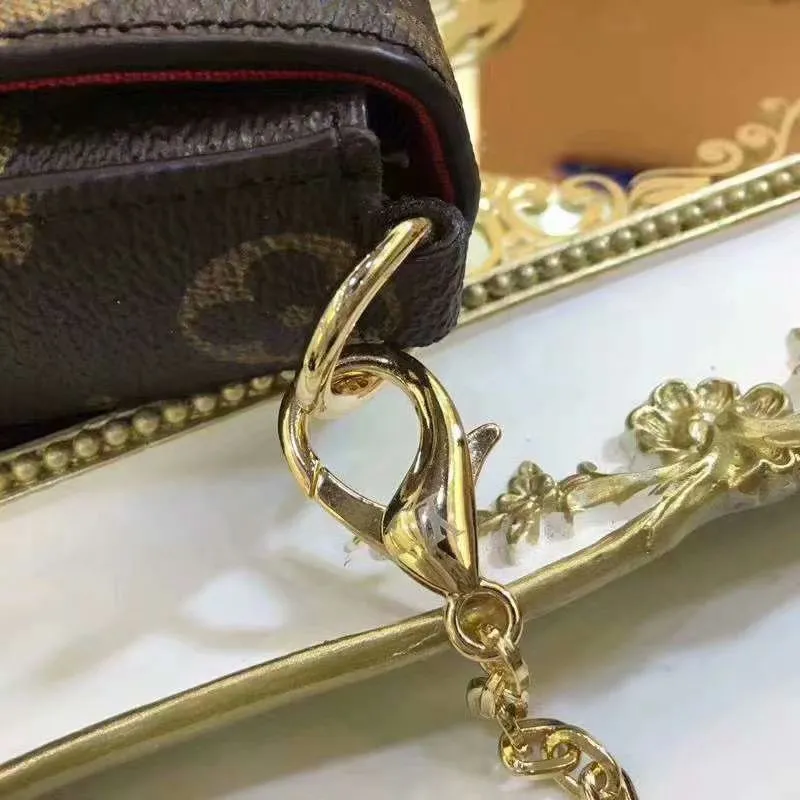 P140 Model: 61276 Size 21/11/2 Introduction: The Louis vuitton Felicie three-piece handbag is elegant and luxurious. It contains two detachable pockets and is a fashionable choice for carrying and organizing your daily necessities. It is more than just a wallet, after removing the gold chain, it can also be used as a charming clutch or small handbag ""