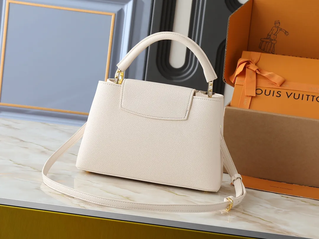 💰420💰Guangzhou goods Upgraded original M12135 M11964 M12751 This Capucines medium handbag draws inspiration from the brand’s classic hard suitcase, transforming the iconic Malletage element into a diamond-shaped metal decoration, which complements the Taurillon cow leather bag body. The pocket design makes it easy to store what you need on the go, and the detachable shoulder strap allows for a variety of carrying methods. Dimensions: 31.05 x 20.0 x 11.0 cm (length x height x width)