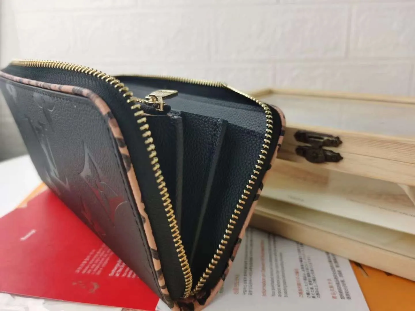 P140M69966 Exclusively available overseas. Made of soft calfskin, the Zippy Lockme wallet combines the iconic design of the zipper wallet with the distinctive elements of the fashion series: LV lettering and a front pocket for easy access to tickets and other items. Reliable wrap-around zipper design with multiple interior pockets and compartments. Dimensions: 19.5 x 10.0 x 2.5 cmM60017