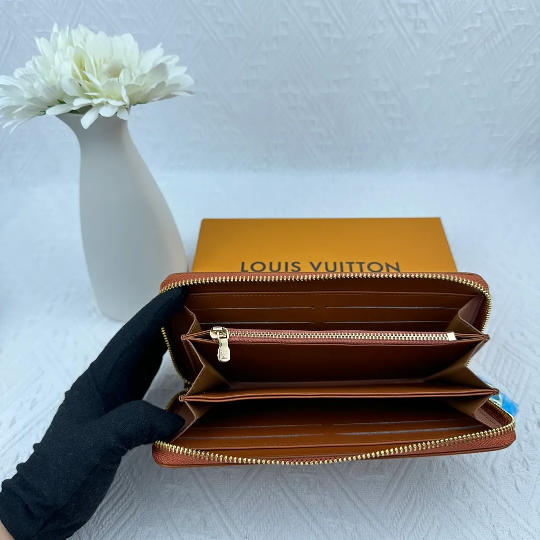 P130 M81511 Earthy Yellow Sewn with padded Monogram embossed lambskin, it complements the Coussin leather boutique series. Beautifully designed with a gold-tone zipper embossed with the LV Circle signature pull, the interior of the all-in-one wallet is packed with practical features, including three large compartments, a coin compartment and 12 business card slots. Dimensions: 19.5 x 10.5 x 2.5 cm