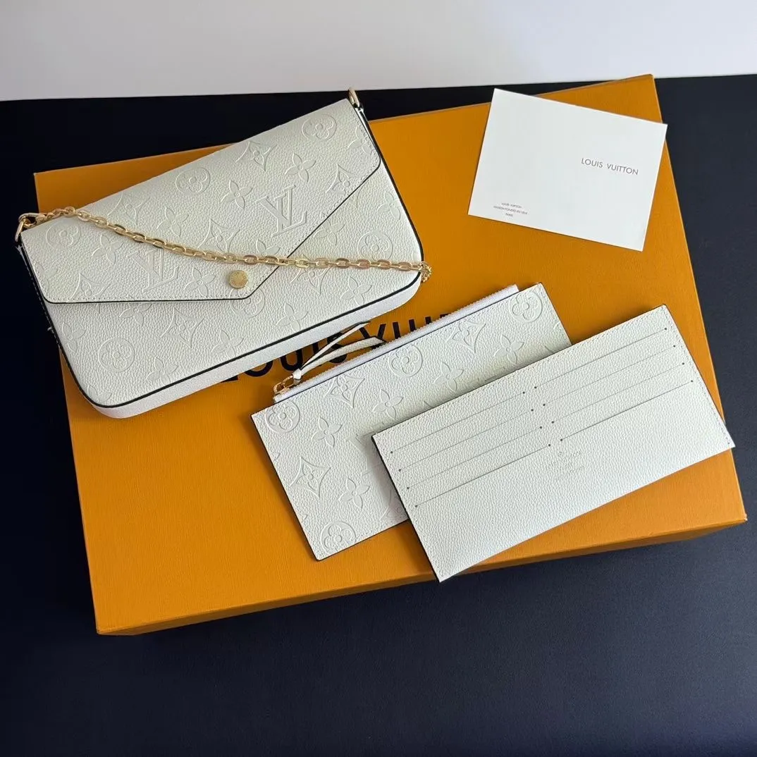 P150💰💖This Pochette Félicie three-in-one💖 chain bag is made of Monogram Empreinte leather, with subtle embossing to present Louis Vuitton’s classic Monogram pattern. The envelope-style construction offers ample interior space, and includes a removable zippered pocket and card compartment. Attach the chain to explore more modern carrying options. Model: M64065 white / 61276 Dimensions: 21 x 12 x 3 cm (length x height x width)
