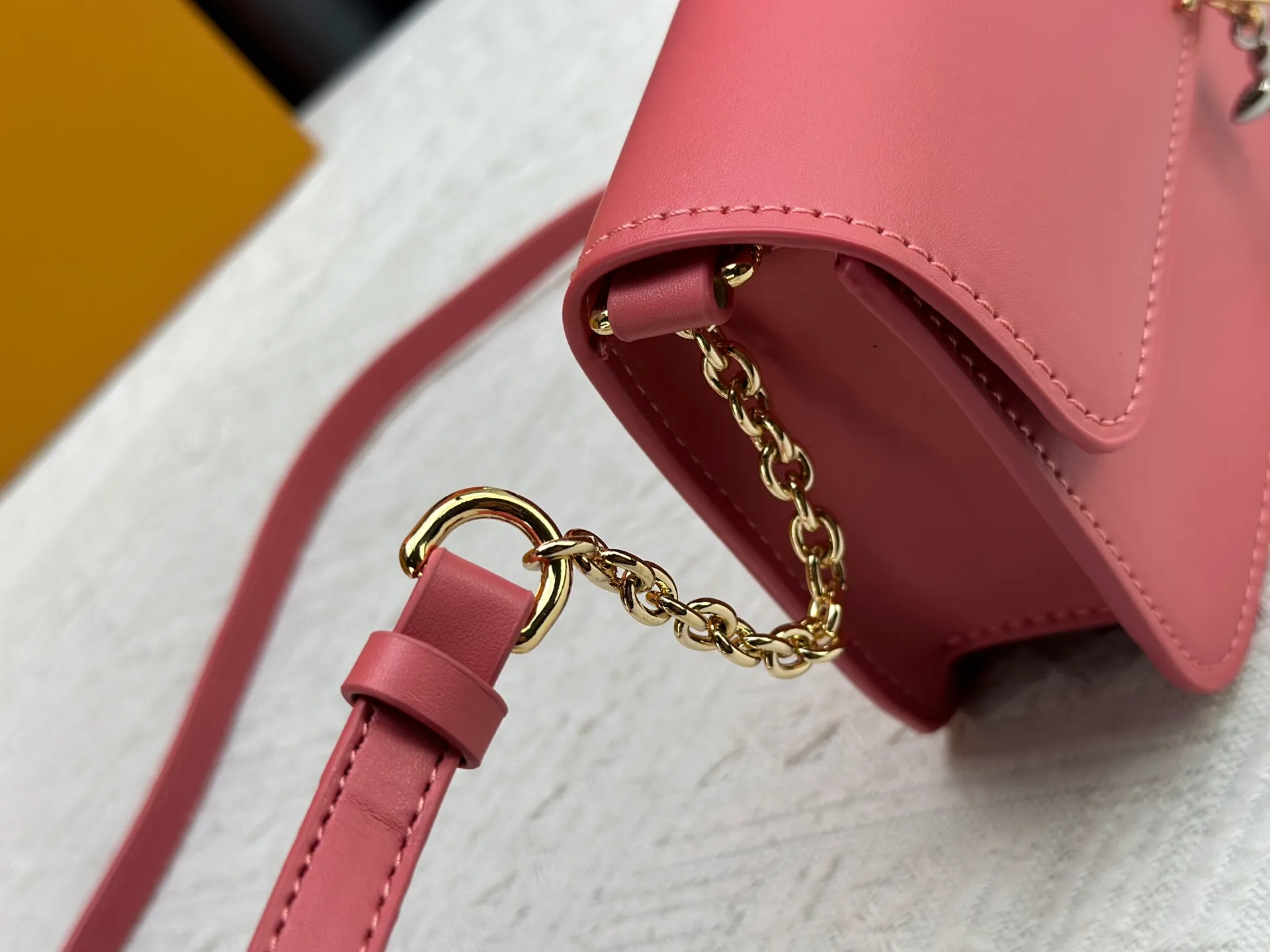 P240 Style number: M14564 This Wallet On Chain handbag is from Louis Vuitton's LV Bloom series. It is cut from cow leather in a fashionable and practical configuration. It's decorated with embellishments inspired by the brand's iconic Monogram pattern. There's plenty of space to store a smartphone, and contrasting metal hardware adds an elegant touch.  11.5 x 4 x 20 cm (height x width x length)