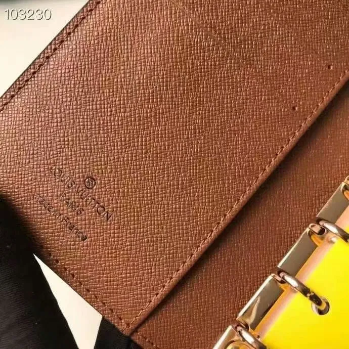 P140 Hot item shipped, model number M20005. This small notepad cover is made of Monogram canvas. It can hold three credit cards and can also be used as an address book, notebook or calendar. 10/12 cm (Length x Height) - Epi leather embossed with delicate LV initials and lined with interwoven textured leather - Button closure - Six-ring binder with three rings in sets, six credit card slots and two internal compartments - Notepad insert available separately
