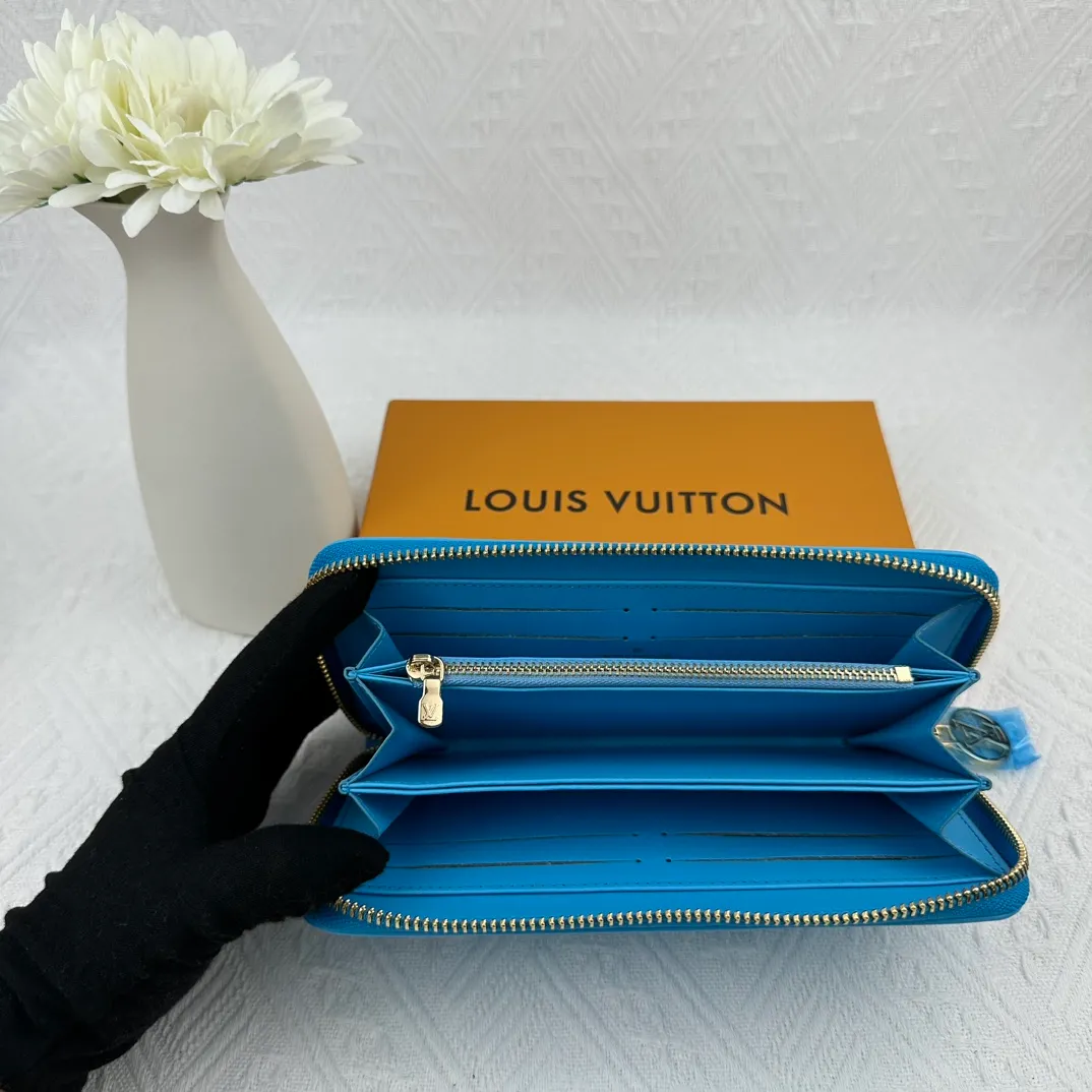 P130 M81511 blue Stitched with padded Monogram embossed lambskin, it complements the Coussin leather boutique collection. Beautifully designed with a gold-tone zipper embossed with the LV Circle signature pull, the interior of the all-in-one wallet is packed with practical features, including three large compartments, a coin compartment and 12 business card slots. Dimensions: 19.5 x 10.5 x 2.5 cm