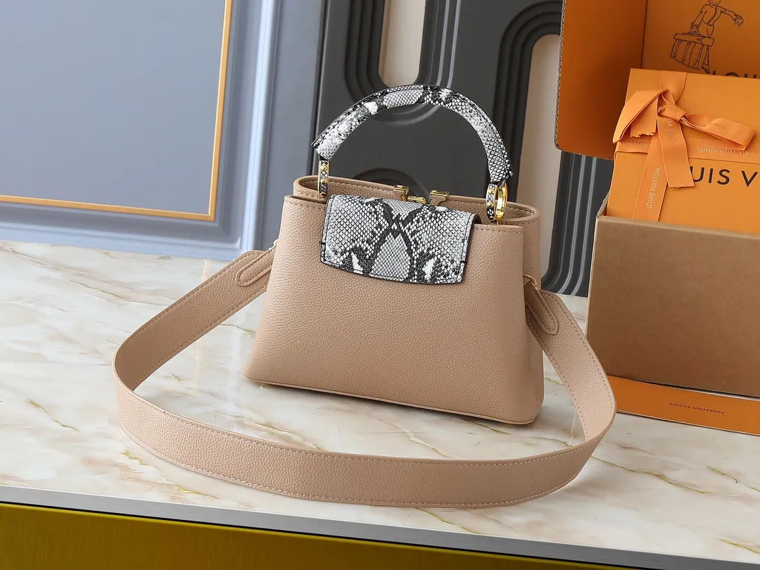 💰340💰Guangzhou goods Upgraded original M80071 M80041 M81410 M81258 M98477 This Capucines handbag displays the subtle sheen of the delicate Taurillon leather and python leather handles, embellished with iconic letters. The detachable wide shoulder strap allows the compact size to be worn on the shoulder or cross-body. Dimensions: 27.0 x 17.3 x 9.0 cm