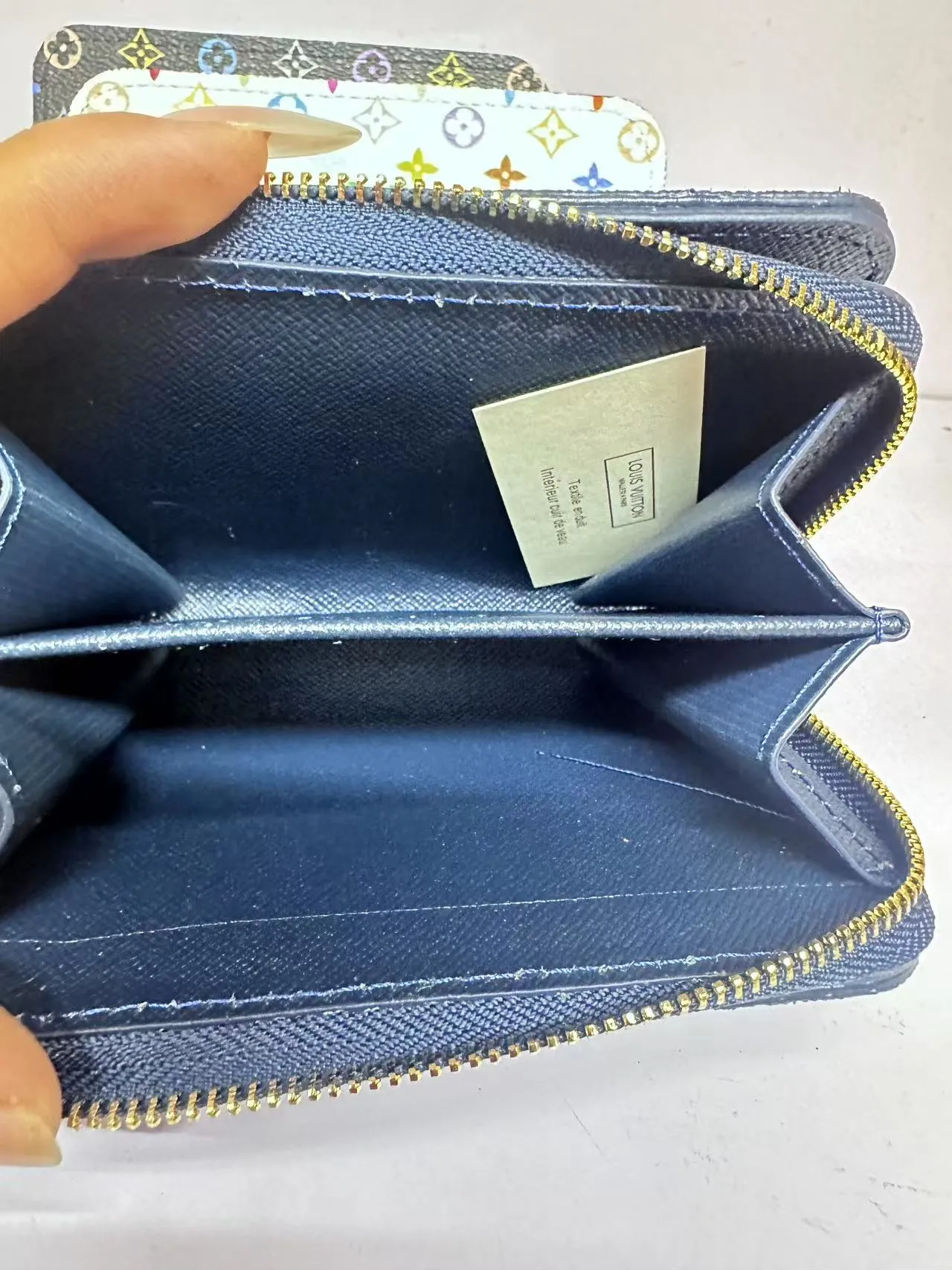 P150 M83689 This Cléa wallet is made of Monogram Empreinte soft grained cowhide, embellished with Louis Vuitton's iconic Monogram embossed pattern. It has a stylish design, is compact yet spacious, and is equipped with an external patch pocket, zipper coin pocket, banknote compartment and six credit card slots.