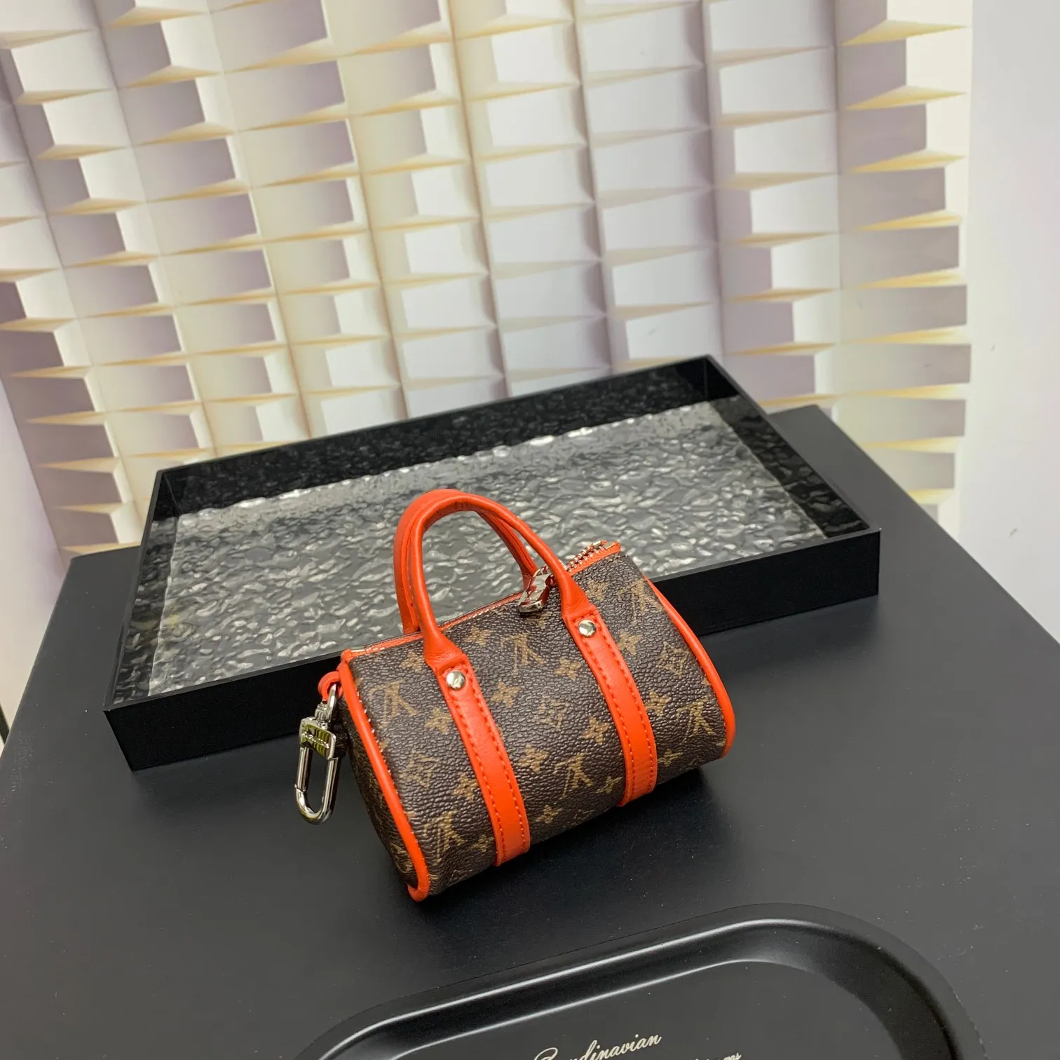 💰200 shipped😍 MINI KEEPALL bag charm and keychain ☀️Louis Vuitton Louis Vuitton lv mini pillow bag pendant ☀️This Mini Keepall bag charm and keychain condenses the classic handbag configuration, boldly showing the spirit of adventure. Monogram canvas with LV inscribed hook buckle, whether hung on a belt or handbag, its zipper closure and built-in keychain ensure secure storage