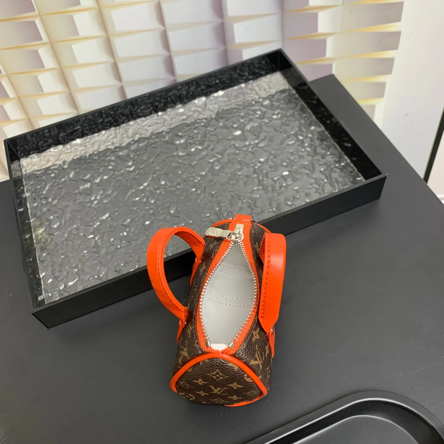 💰200 shipped😍 MINI KEEPALL bag charm and keychain ☀️Louis Vuitton Louis Vuitton lv mini pillow bag pendant ☀️This Mini Keepall bag charm and keychain condenses the classic handbag configuration, boldly showing the spirit of adventure. Monogram canvas with LV inscribed hook buckle, whether hung on a belt or handbag, its zipper closure and built-in keychain ensure secure storage