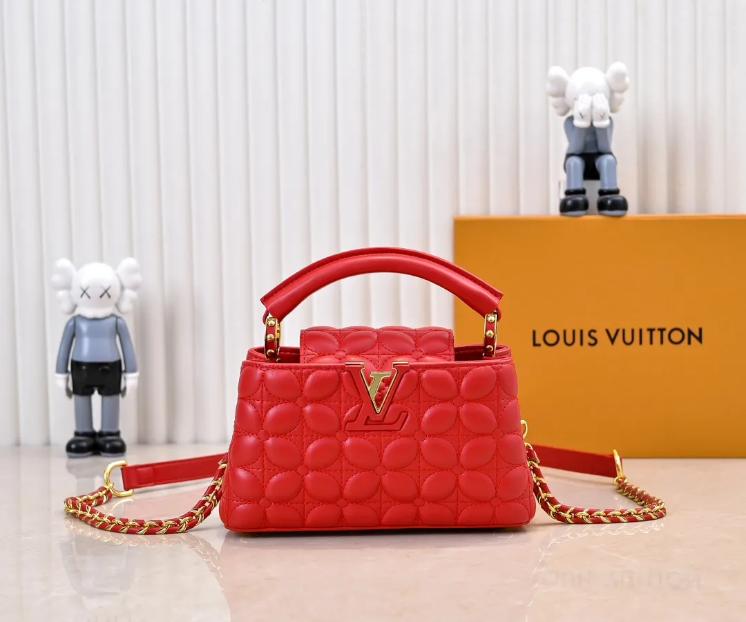 Upgraded version P420 M23998 Red This Monogram embroidered flower emerges from the elegant quilting, bringing the style of Louis Vuitton store decoration to the Capucines mini handbag. Soft sheepskin creates a stable structure and trim, and the detachable shoulder strap allows for comfortable shoulder or cross-body wear. Dimensions: 22 x 12 x 8 cm