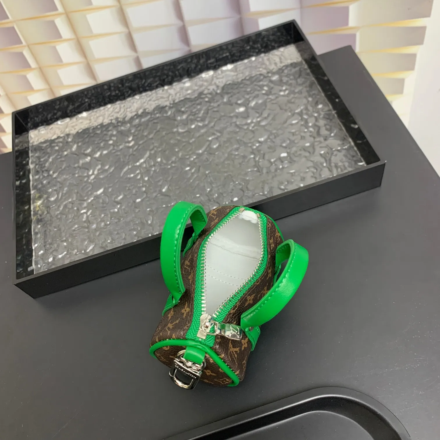 💰200 shipped😍 MINI KEEPALL bag charm and keychain ☀️Louis Vuitton Louis Vuitton lv mini pillow bag pendant ☀️This Mini Keepall bag charm and keychain condenses the classic handbag configuration, boldly showing the spirit of adventure. Monogram canvas with LV inscribed hook buckle, whether hung on a belt or handbag, its zipper closure and built-in keychain ensure secure storage