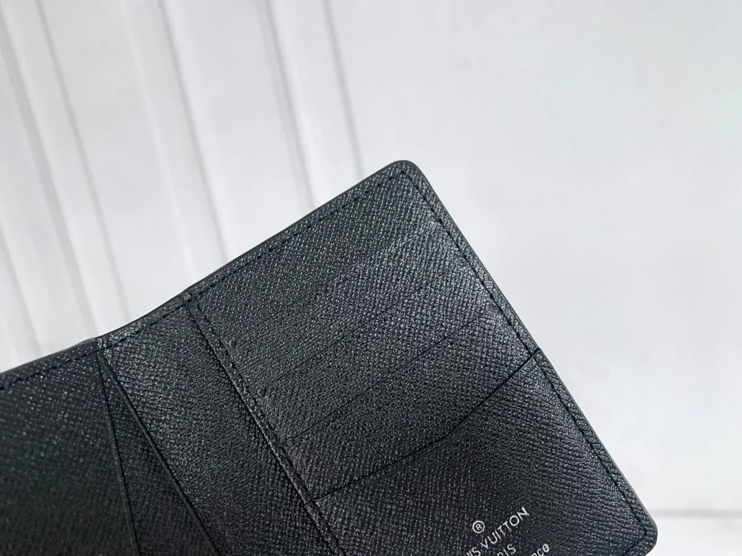 💰80 💎Small card holder Louis vuitton's pocket leather wallet has seven compartments, which can hold credit cards, bus cards, business cards, and even city maps. Damier canvas, leather-bound - two credit card compartments - four inner compartments - one outer compartment. ❤️ Model M63144 Size 7X11.