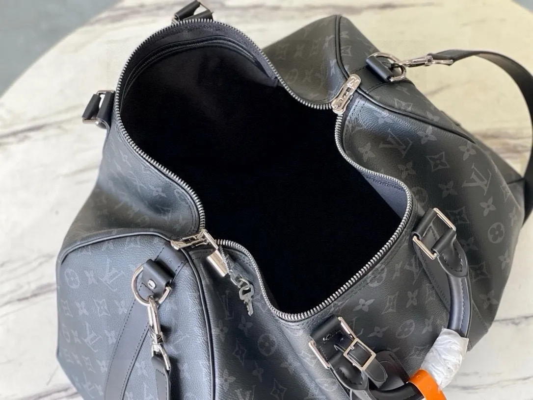 💰1000 (50 size) top original order M40601 black flower, spacious capacity, flexible use. Durable, safe and reliable. Fashionable style, mature and stable. Features a secure double zipper and padlock, making it perfect for business or pleasure. Size: 50x 29× 22cm