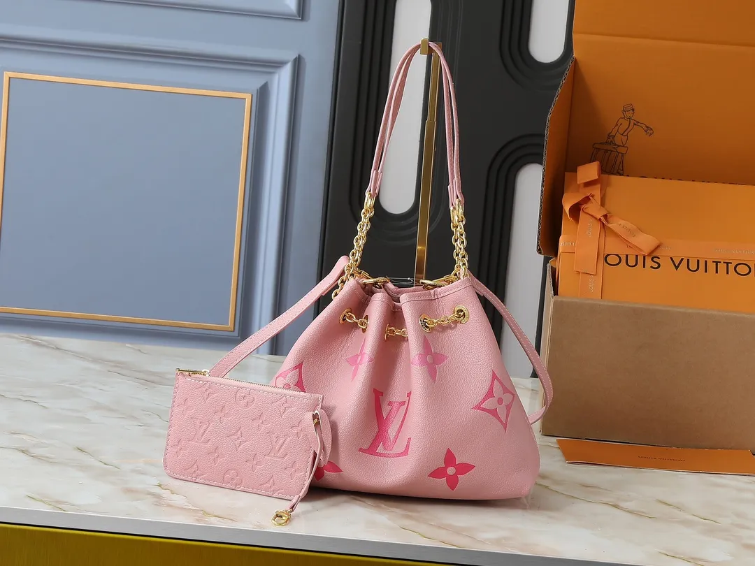💰260💰Upgraded original version ✨M11283 M25453 M47209 M46545 M46492 This Summer Bundle handbag is from the Dégradé series. The new drawstring design adds a summer atmosphere. The Monogram Empreinte embossed leather bag features a gradient tone to brighten any seasonal look. The double handles and detachable cross-body strap provide a variety of stylish carrying options, making it a great companion for travel day and night. Detailed features: 28 x 20 x 11.5 (Length x Height x Width)