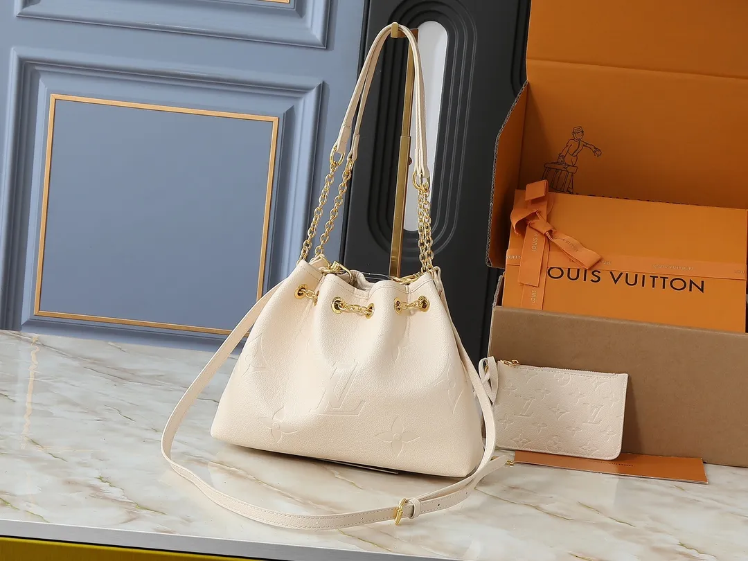 💰260💰Upgraded original version ✨M11283 M25453 M47209 M46545 M46492 This Summer Bundle handbag is from the Dégradé series. The new drawstring design adds a summer atmosphere. The Monogram Empreinte embossed leather bag features a gradient tone to brighten any seasonal look. The double handles and detachable cross-body strap provide a variety of stylish carrying options, making it a great companion for travel day and night. Detailed features: 28 x 20 x 11.5 (Length x Height x Width)