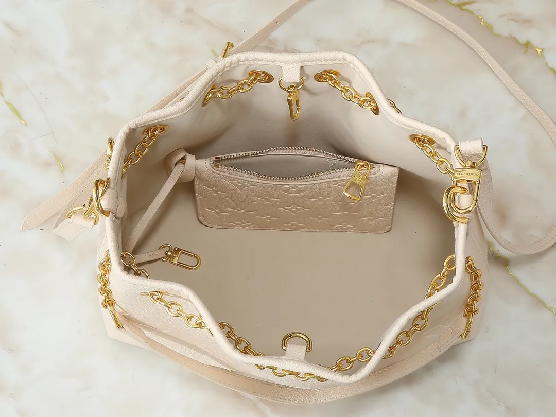 💰260💰Upgraded original version ✨M11283 M25453 M47209 M46545 M46492 This Summer Bundle handbag is from the Dégradé series. The new drawstring design adds a summer atmosphere. The Monogram Empreinte embossed leather bag features a gradient tone to brighten any seasonal look. The double handles and detachable cross-body strap provide a variety of stylish carrying options, making it a great companion for travel day and night. Detailed features: 28 x 20 x 11.5 (Length x Height x Width)