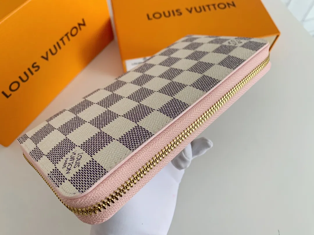💰100 💎M60017 inner color ❤️white plaid pink ZIPPY zipper wallet. The Zippy wallet pays homage to Louis Vuitton's heritage of travel and trunk making, with a travel-style patch and Louis Vuitton logo. With its compact interior and simple design, this wallet is ideal for everyday use. Model M60017. Size: 19x10.