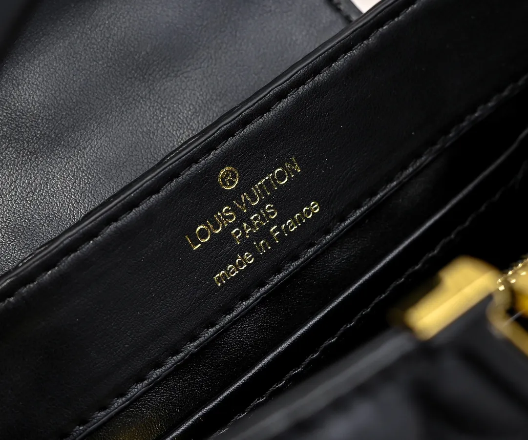 Upgraded version P420 M23998 Black This Monogram embroidered flower emerges from the elegant quilting, bringing the style of Louis Vuitton store decoration to the Capucines mini handbag. Soft sheepskin creates a stable structure and trim, and the detachable shoulder strap allows for comfortable shoulder or cross-body wear. Dimensions: 22 x 12 x 8 cm
