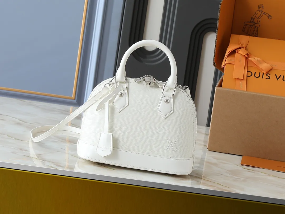 💰240💰Upgraded original M41160 M41327 M40855 M40862 M53152 This Alma BB handbag is based on a classic Louis Vuitton bag designed in 1934 with an Art Deco style. In 2010, on the occasion of the 20th anniversary of the official launch of the Alma bag, a mini model was specially designed for the daughter of the woman who owns this bag. The Alma BB bag features a removable shoulder strap for lightweight cross-body wear. A new and stylish take on a classic shape, this bag in Epi leather is available in a range of bright, vibrant colors. Size: 25×19×12cm