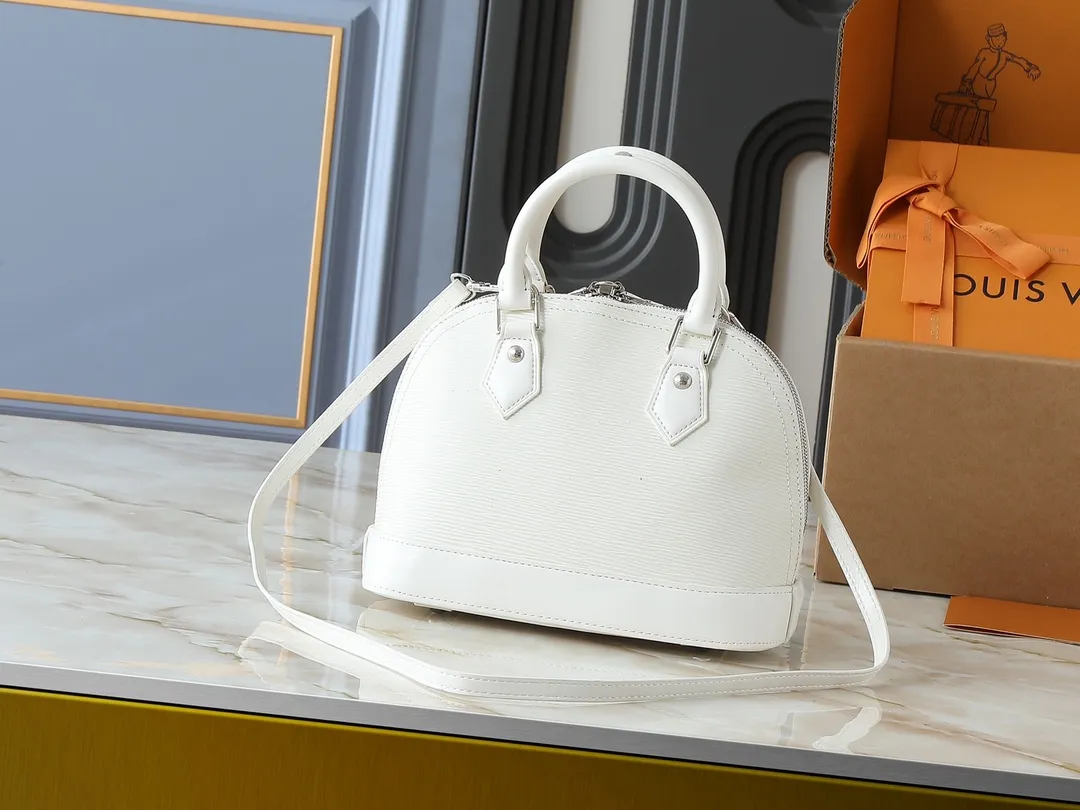💰240💰Upgraded original M41160 M41327 M40855 M40862 M53152 This Alma BB handbag is based on a classic Louis Vuitton bag designed in 1934 with an Art Deco style. In 2010, on the occasion of the 20th anniversary of the official launch of the Alma bag, a mini model was specially designed for the daughter of the woman who owns this bag. The Alma BB bag features a removable shoulder strap for lightweight cross-body wear. A new and stylish take on a classic shape, this bag in Epi leather is available in a range of bright, vibrant colors. Size: 25×19×12cm