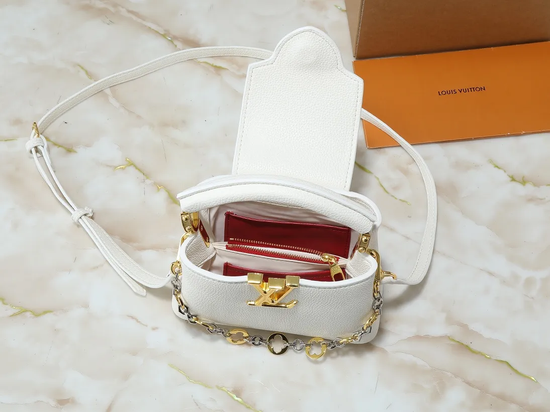 💰380💰Guangzhou goods Upgraded original M12935 M12936 M12937 M12938 This Capucines mini handbag is from the Capucines Chain On You series. It is made of soft Taurillon cow leather and has ample space to store daily necessities such as short wallets, keys, and lipstick. The jewelry-style double-plated chain features Monogram floral details that complement the rounded LV letters, and the flap can be tucked in or out. Dimensions: 21.0 x 14.0 x 8.0 cm (length x height x width)