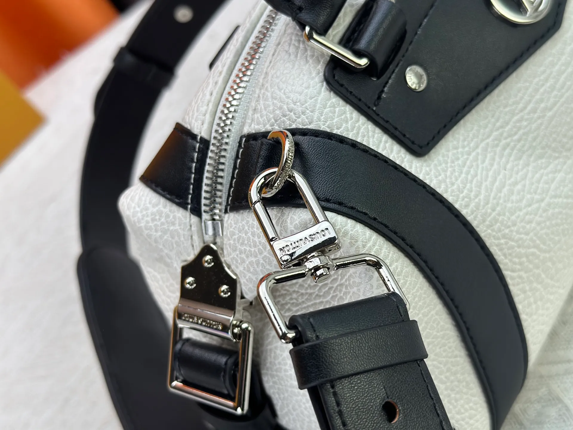 P300 small P320 medium P340 large M25557 M25561 M25561 M25566 Black M14623 mini M14514 small M14700 medium Dark gray M14702 medium Light gray M14721 small This Nano LV Rider handbag is from 2025 For the spring and summer series, pixelated grained sheep leather is blended with smooth cow leather elements, and the LV Circle logo is highlighted with elegant patches. The foldable configuration makes it easy to store in a suitcase, and the modern design adds a rock-n-roll edge to any look.  Mini 10 x 10 x 23 cm Small 12 × 12 × 30 cm Medium 15 × 15 × 38 cm (H x W x L) Sheep leather Cow leather trim Textile lining Metal hardware Zipper closure Side slip straps Internal pocket Holds a 6.7-inch smartphone, Romy card holder and lipstick Shoulder strap: removable, adjustable Strap half-length: 30.0 cm Bag strap half length adjustable to: 45.0 cm Handle: double handle