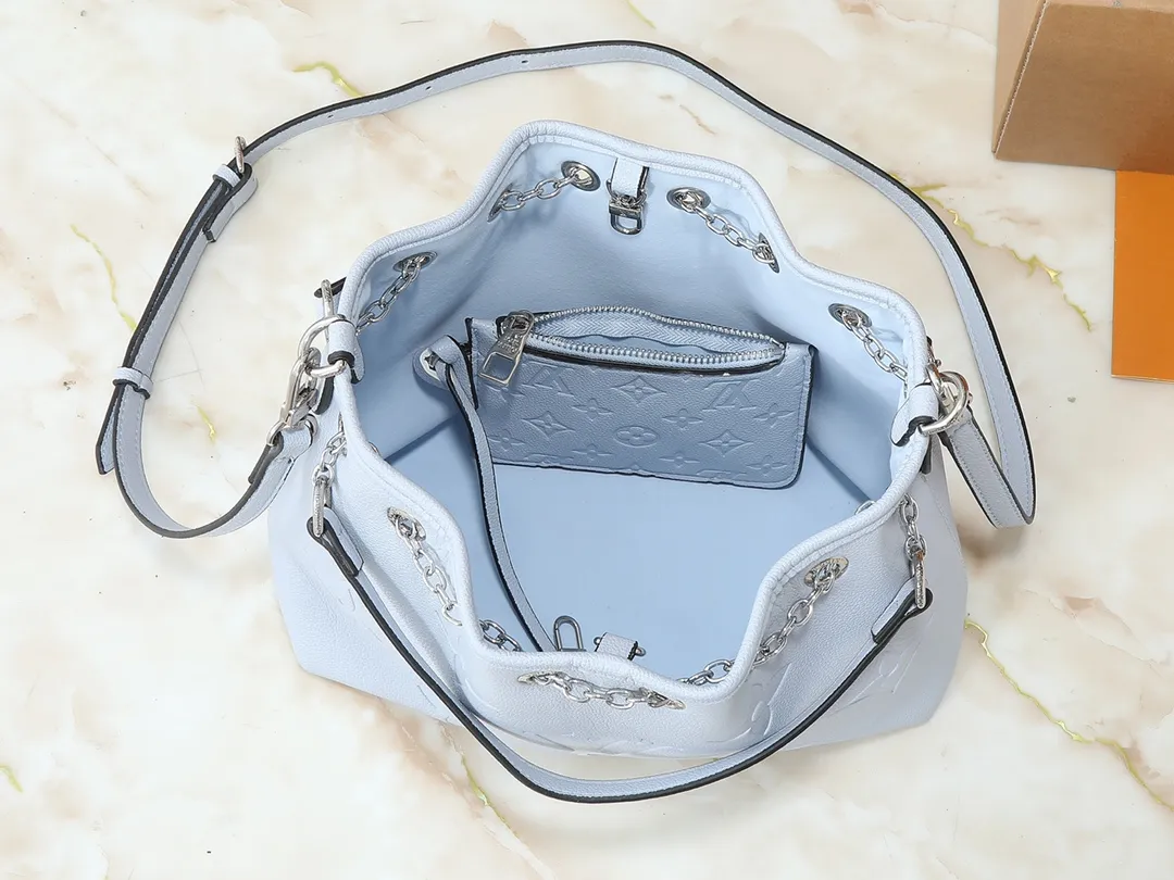 💰260💰Upgraded original version ✨M11283 M25453 M47209 M46545 M46492 This Summer Bundle handbag is from the Dégradé series. The new drawstring design adds a summer atmosphere. The Monogram Empreinte embossed leather bag features a gradient tone to brighten any seasonal look. The double handles and detachable cross-body strap provide a variety of stylish carrying options, making it a great companion for travel day and night. Detailed features: 28 x 20 x 11.5 (Length x Height x Width)