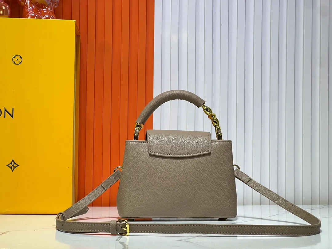Batch 360💰Upgraded original M23943 M23944 M23945 M24698 M24989 This Capucines mini handbag incorporates exquisite Monogram flowers on the handle, presenting the three-dimensional look of the LV logo with delicate brushstrokes, injecting dazzling luster into the soft design. Full-grain Taurillon leather is designed to fit a smartphone, short wallet and other small essentials. Dimensions: Small 21.0 x 14.0 x 8.0 cm (L x H x W) Large 27x 17.5 x 9.0 cm (L x H x W)