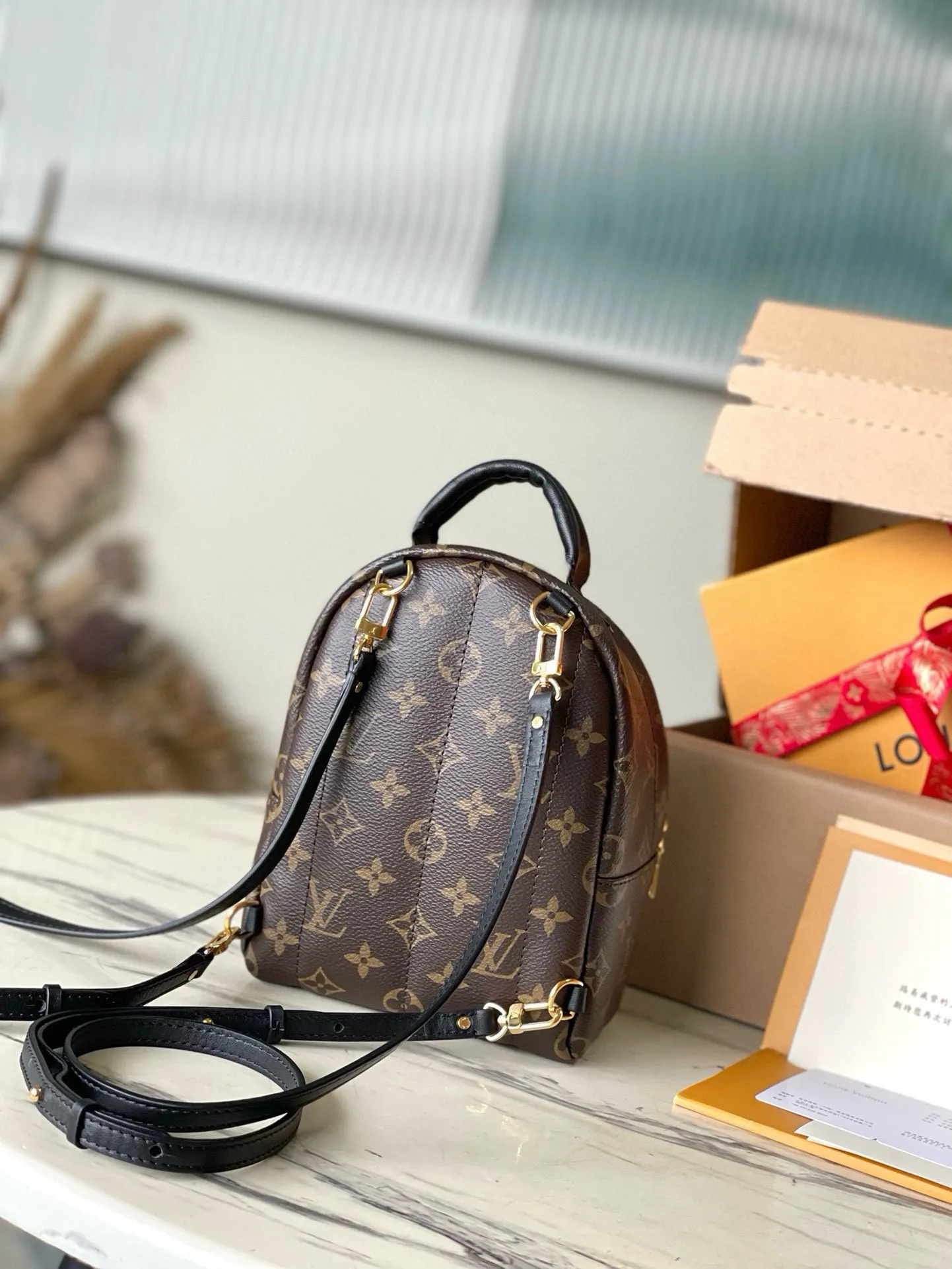 💰720 Top original M44873 presbyopic mini backpack.  Nicolas Ghesquière gives this backpack an astonishing style change, transforming a simple daily necessities into a fashionable and extremely charming urban bag. This mini backpack made of soft Monogram canvas is petite and cute, and has multi-purpose straps for easy cross-body wear. Monogram coated canvas material - Soft calfskin trim, foam backing - Padded leather top handles - Pair of adjustable shoulder straps - Nylon lining - Gold-tone hardware - Engraved zipper puller - Zippered front pocket on the outside of the bag - Flat inner pocket ✈️Size: 16X20X9cm