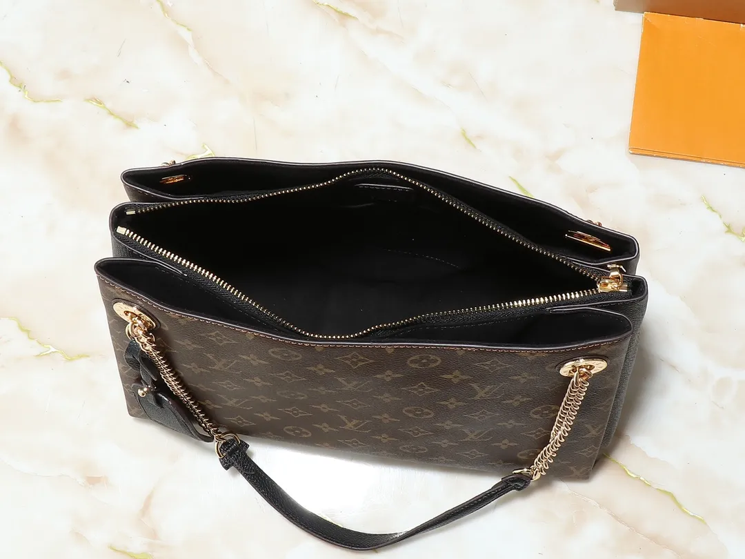 💰300💰Upgraded original M43772.M43759 M43758 This Surene MM Chain Handbag in Letter Empreinte Leather with its gold chain is as functional as it is sophisticated. Very easy to put on thanks to the leather shoulder pads and decorative chain. The large size of this suitcase means it easily fits A4 documents as well as all your daily essentials. The embossed pattern on supple leather is deep enough to stay in place for a while while still maintaining its soft feel. Size: length 37*26*15cm